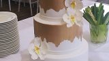Gold and white orchids wedding cake